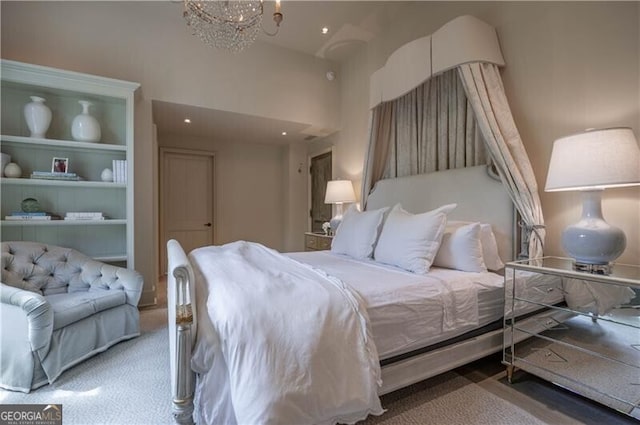2979 Ridgewood Rd NW, Atlanta, GA 30327 - bedroom with carpet flooring, a chandelier, and a high ceiling