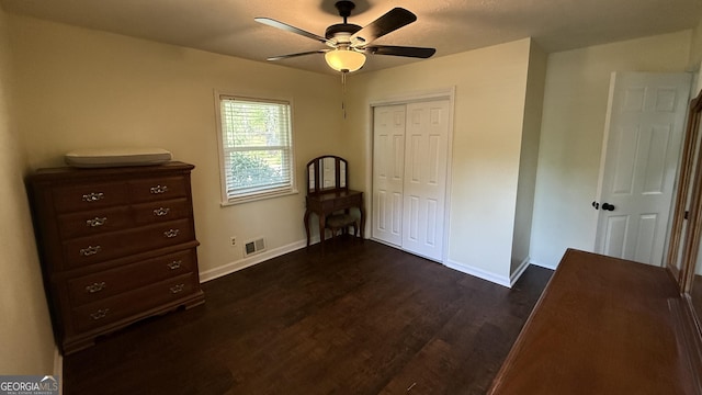 1093 Grace St SW, Mableton, GA 30126 - unfurnished bedroom with dark wood-style flooring, a closet, baseboards, visible vents, and ceiling fan