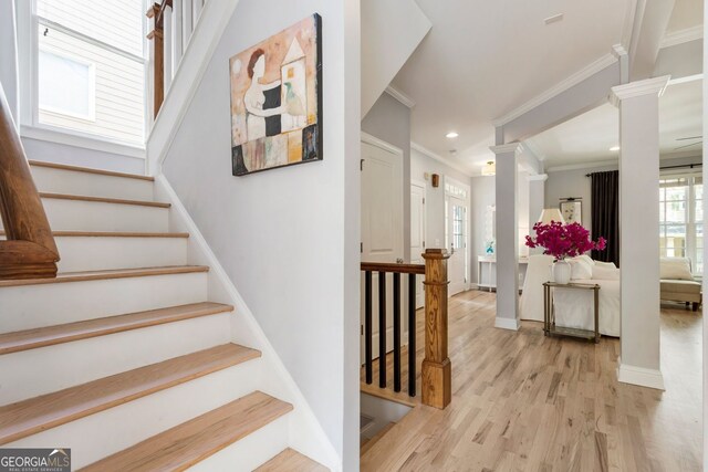 2238 Parkview Ct NW, Atlanta, GA 30318 - staircase with crown molding, recessed lighting, baseboards, wood finished floors, and ornate columns