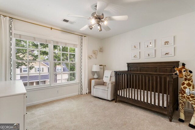 2238 Parkview Ct NW, Atlanta, GA 30318 - bedroom featuring ceiling fan, visible vents, a crib, baseboards, and carpet flooring