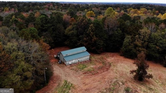 aerial view featuring a view of trees