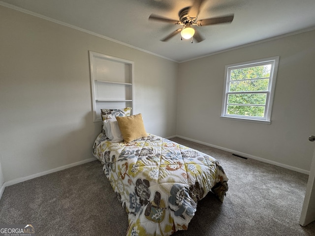 bedroom with baseboards, crown molding, a ceiling fan, carpet floors, and visible vents