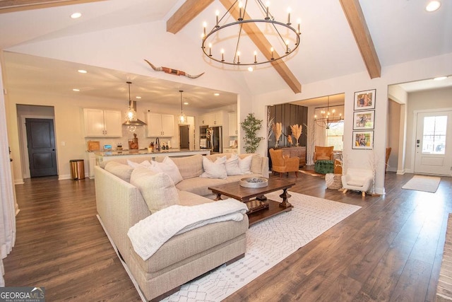 living area featuring dark wood-type flooring, a notable chandelier, beam ceiling, and recessed lighting