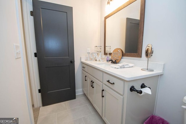 bathroom with tile patterned floors and vanity