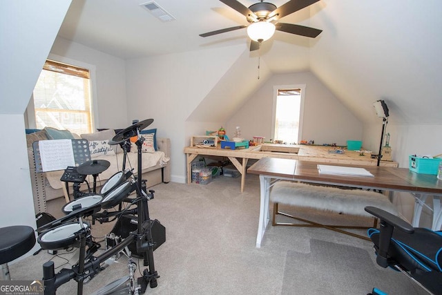 interior space featuring visible vents, ceiling fan, and lofted ceiling