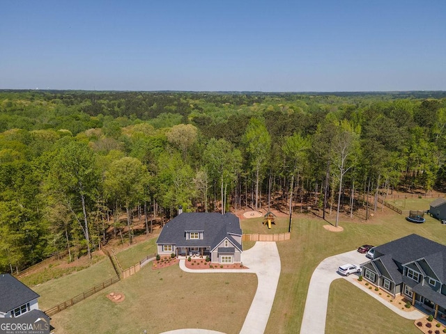 aerial view featuring a wooded view