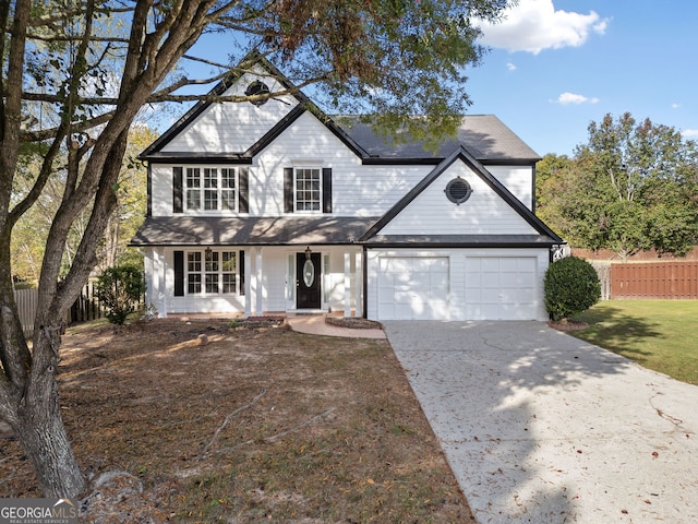 946 Steadman Ter, Marietta, GA 30064 - view of front of home featuring a garage, fence, covered porch, and concrete driveway