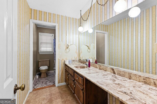 324 County Line Rd, Fayetteville, GA 30215 - bathroom with tile patterned floors, toilet, baseboards, wallpapered walls, and vanity