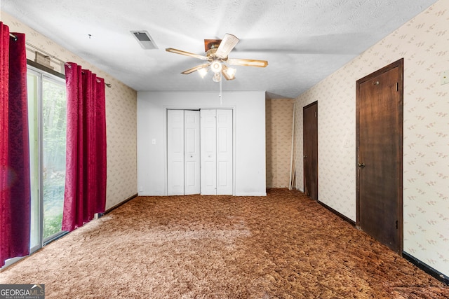 324 County Line Rd, Fayetteville, GA 30215 - unfurnished bedroom with carpet flooring and wallpapered walls