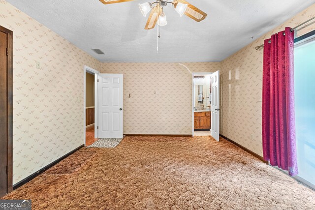 324 County Line Rd, Fayetteville, GA 30215 - interior space featuring a textured ceiling, baseboards, light colored carpet, wallpapered walls, and a ceiling fan