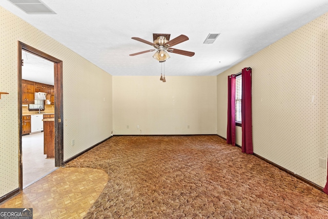 324 County Line Rd, Fayetteville, GA 30215 - empty room featuring wallpapered walls, a ceiling fan, and visible vents