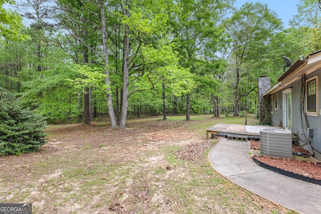 324 County Line Rd, Fayetteville, GA 30215 - view of yard with central air condition unit and a wooden deck
