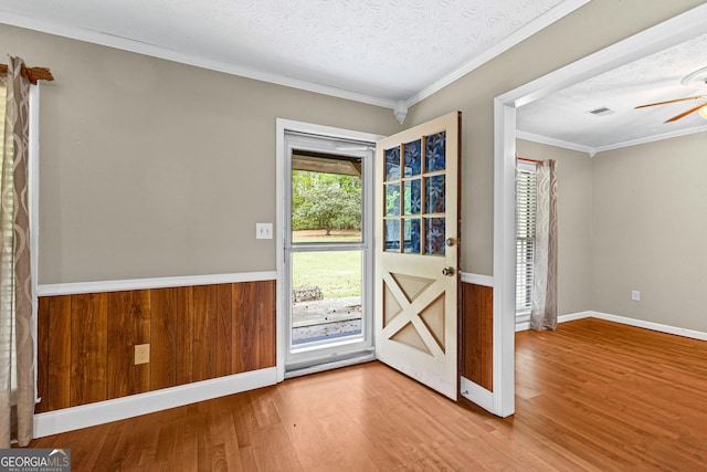 324 County Line Rd, Fayetteville, GA 30215 - doorway featuring a ceiling fan, baseboards, crown molding, and wood finished floors