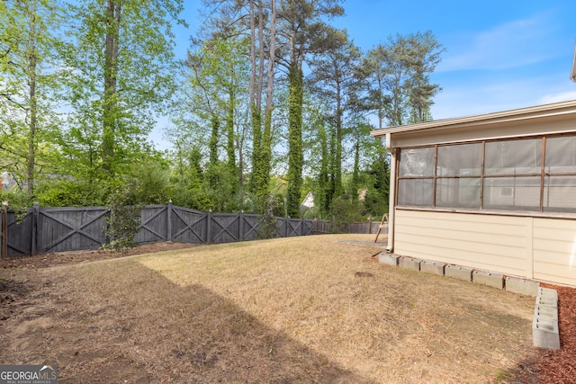 view of yard with a fenced backyard