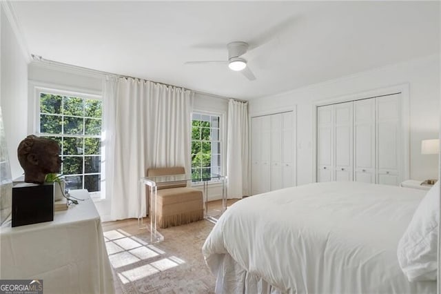1305 Old Woodbine Rd, Atlanta, GA 30319 - bedroom with multiple closets, ornamental molding, and ceiling fan