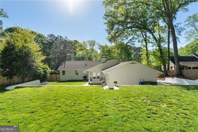 1305 Old Woodbine Rd, Atlanta, GA 30319 - rear view of property with fence, a patio, a lawn, and a chimney