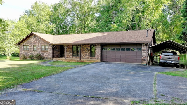 5680 Abbotts Bridge Rd, Johns Creek, GA 30097 - ranch-style house featuring a front yard, a carport, an attached garage, brick siding, and driveway