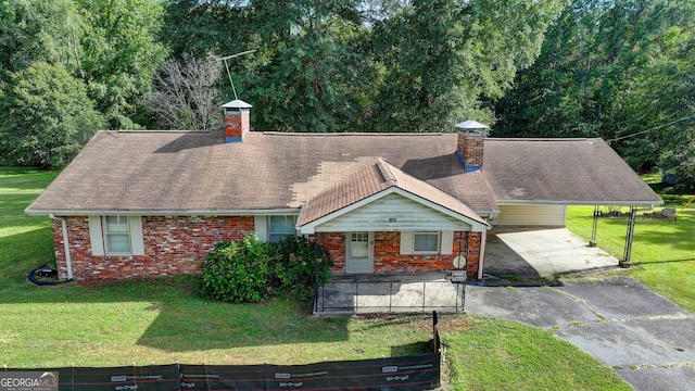 5680 Abbotts Bridge Rd, Johns Creek, GA 30097 - view of front of home featuring a chimney, aphalt driveway, a front yard, and brick siding