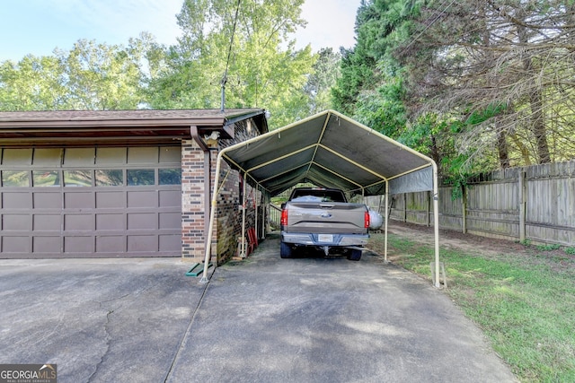 5680 Abbotts Bridge Rd, Johns Creek, GA 30097 - view of car parking featuring aphalt driveway, a carport, and fence