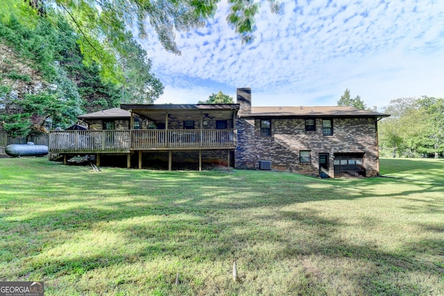5680 Abbotts Bridge Rd, Johns Creek, GA 30097 - rear view of house featuring central AC, brick siding, a deck, and a lawn