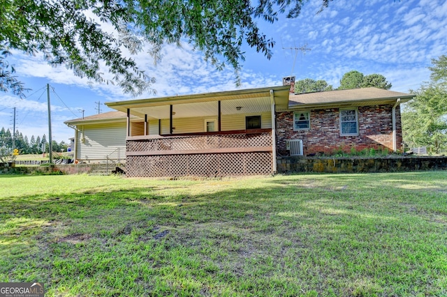 5680 Abbotts Bridge Rd, Johns Creek, GA 30097 - back of house with a yard, central AC, and a chimney