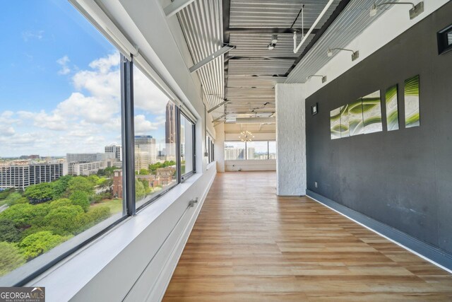 120 Ralph Mcgill Blvd NE Unit 1304 & 1305, Atlanta, GA 30308 - hallway with wood finished floors and a city view