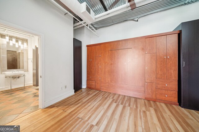 120 Ralph Mcgill Blvd NE Unit 1304 & 1305, Atlanta, GA 30308 - unfurnished bedroom with a closet and light wood-style flooring