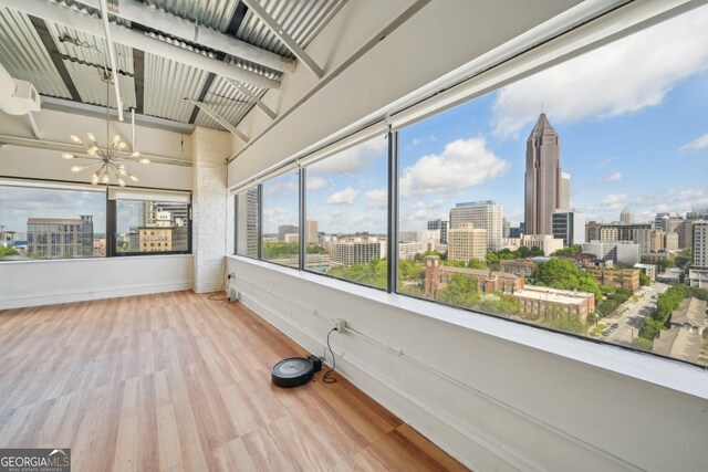 120 Ralph Mcgill Blvd NE Unit 1304 & 1305, Atlanta, GA 30308 - unfurnished sunroom featuring a view of city and a chandelier