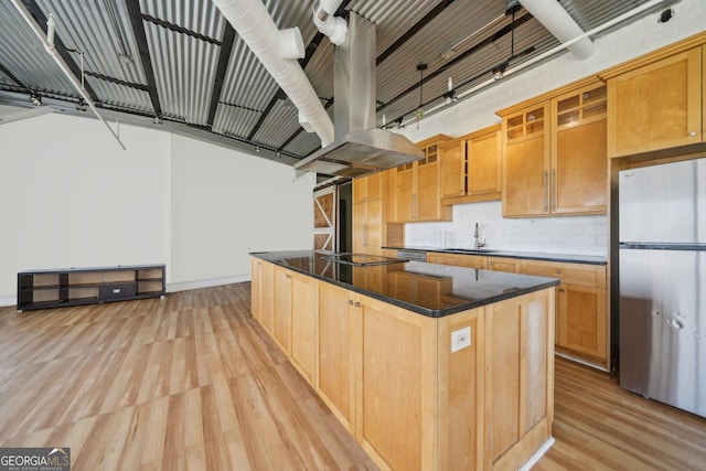 120 Ralph Mcgill Blvd NE Unit 1304 & 1305, Atlanta, GA 30308 - kitchen featuring appliances with stainless steel finishes, light wood-style flooring, a center island, tasteful backsplash, and dark stone counters