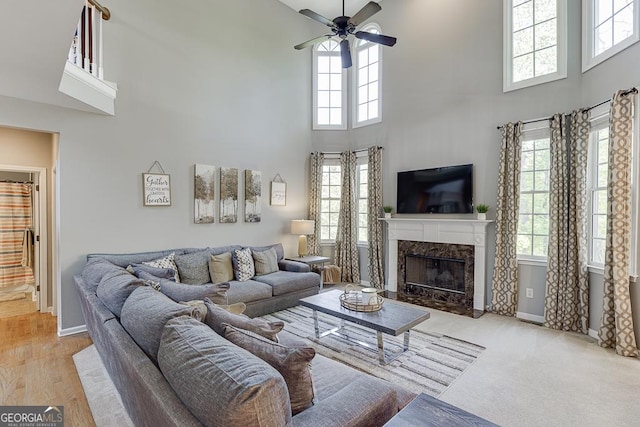 living room featuring a wealth of natural light and a high ceiling