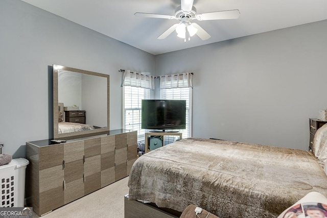 carpeted bedroom featuring ceiling fan