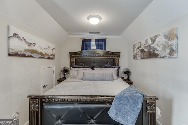 bedroom with visible vents and lofted ceiling