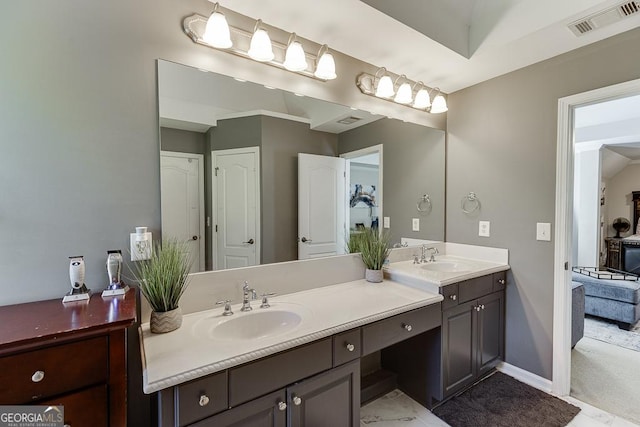 full bath featuring visible vents, baseboards, marble finish floor, and vanity