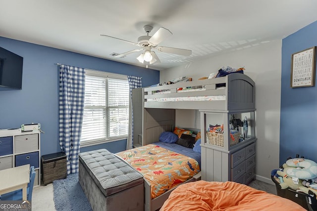 carpeted bedroom with baseboards and a ceiling fan