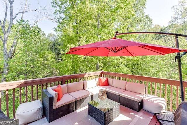 wooden deck featuring outdoor lounge area