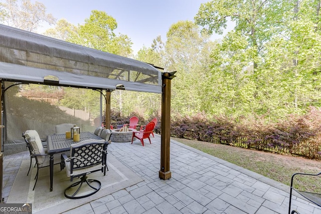 view of patio with an outdoor fire pit