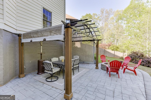 view of patio featuring a pergola and fence