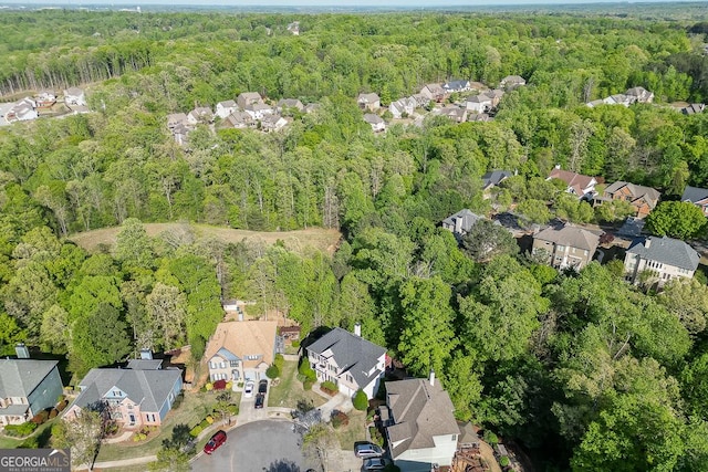 aerial view featuring a residential view and a forest view