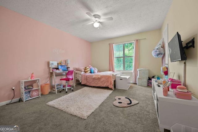 carpeted bedroom with a textured ceiling and a ceiling fan