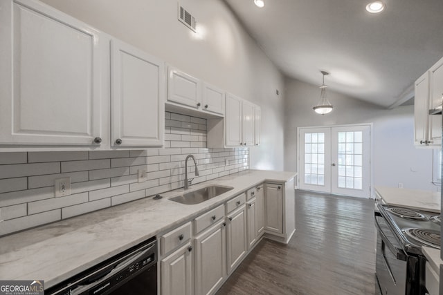 kitchen featuring lofted ceiling, electric stove, dishwashing machine, french doors, and a sink