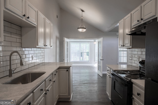 kitchen with a sink, black appliances, white cabinetry, under cabinet range hood, and dark wood-style floors