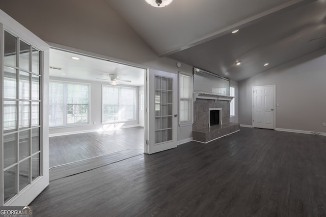 unfurnished living room with dark wood-style floors, baseboards, recessed lighting, a fireplace with raised hearth, and ceiling fan