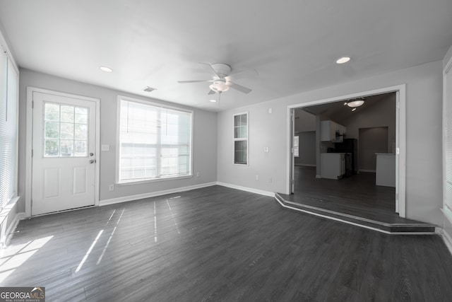 unfurnished living room featuring ceiling fan, baseboards, dark wood-type flooring, visible vents, and recessed lighting