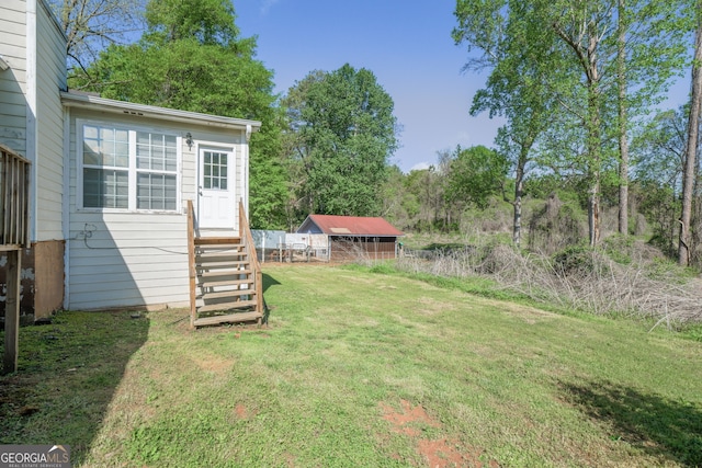 view of yard with entry steps
