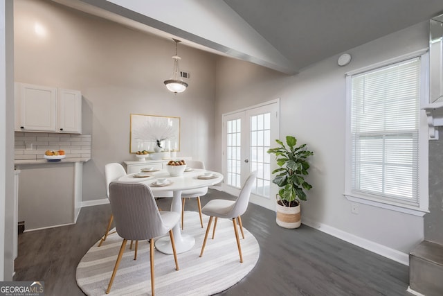 dining space featuring high vaulted ceiling, french doors, dark wood finished floors, baseboards, and visible vents