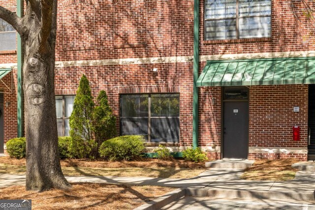 791 Wylie St SE Unit 105, Atlanta, GA 30316 - bathroom featuring an enclosed shower, tile patterned floors, vanity, a tub to relax in, and tile walls