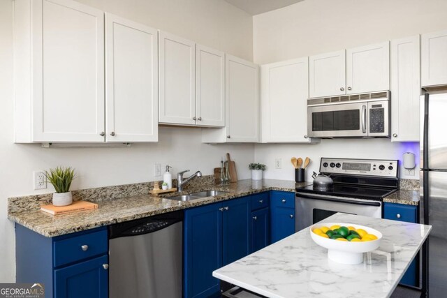 791 Wylie St SE Unit 105, Atlanta, GA 30316 - living area featuring brick wall and baseboards