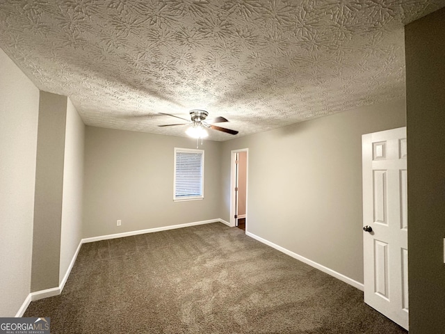 659 Country Club Rd, Newnan, GA 30263 - spare room featuring dark colored carpet, baseboards, a textured ceiling, and ceiling fan