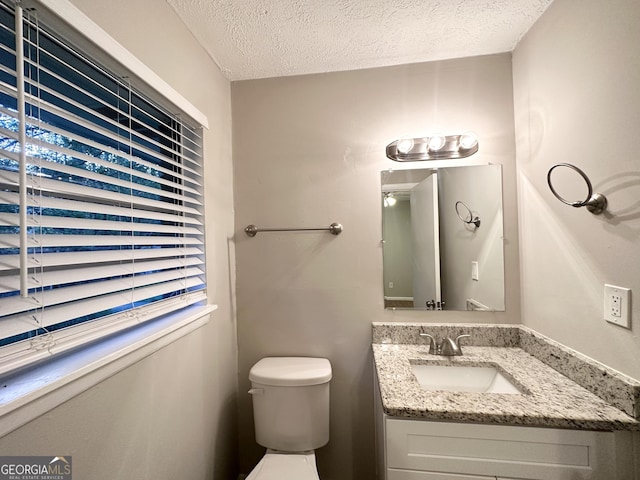 659 Country Club Rd, Newnan, GA 30263 - bathroom featuring vanity, a textured ceiling, and toilet