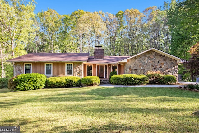 215 N Mourning Dove Dr N, Fayetteville, GA 30215 - view of front of house with stone siding, a chimney, and a front lawn